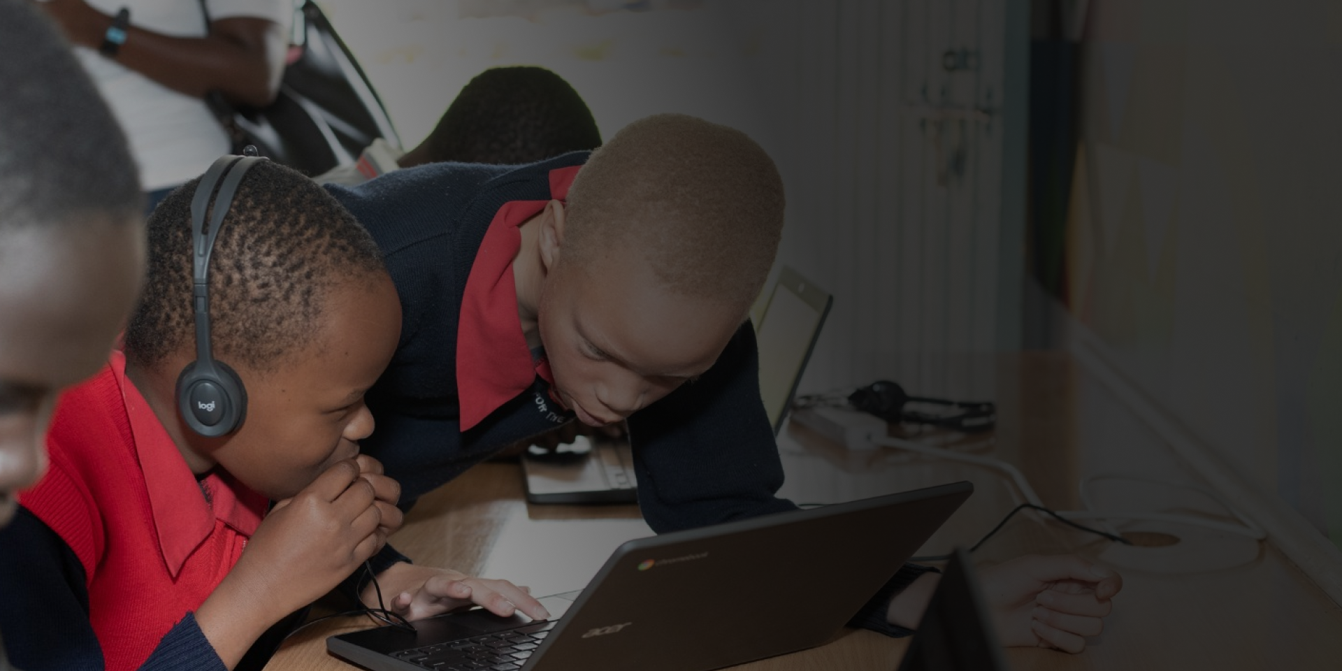 Students in an accessibility lab at Thika Primary School For the Blind, Kenya using a Chromebook.